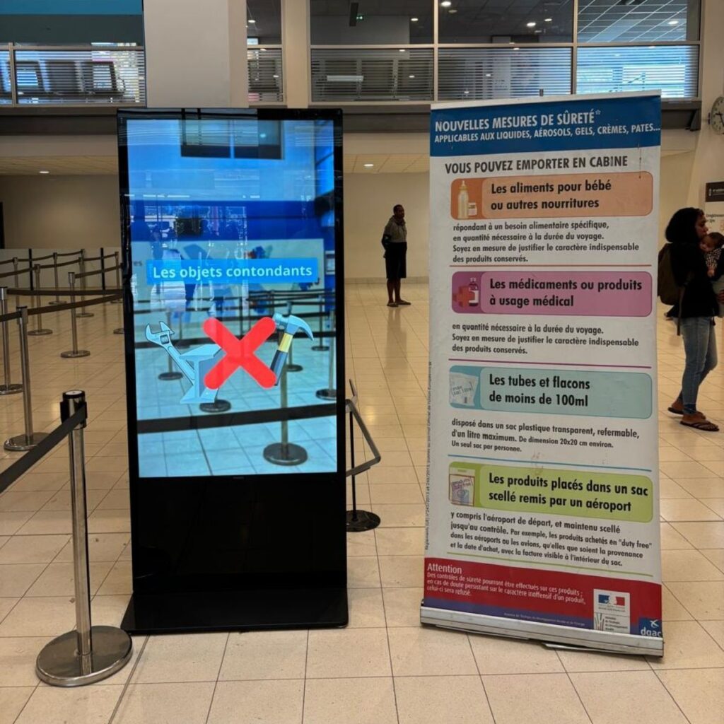 Philips totem displaying airport security information at La Tontouta
